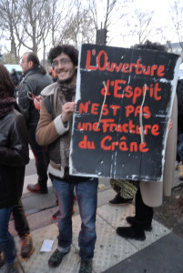 Paris climate protester hit head