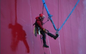 Greenpeace boarder climbing