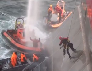 Greenpeace boarders surrounded by Russian security 2