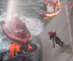 Greenpeace boarders surrounded by Russian  security