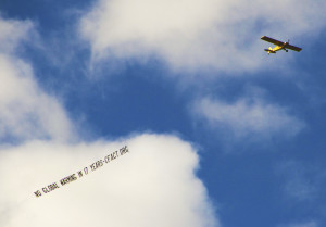 CFACT NY air banner no global warming 17 years plane