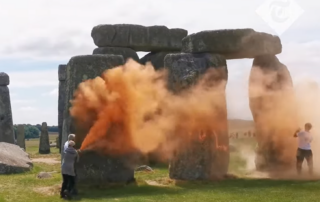 Watch climate campaigners deface Stonehenge